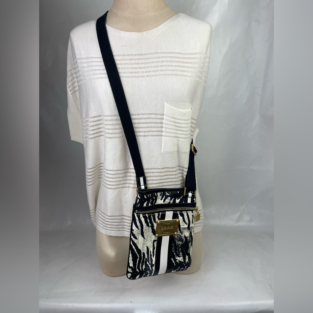 L.A.M.B. Gwen Stefani News Print Zebra Design Coated Canvas crossbody bag.